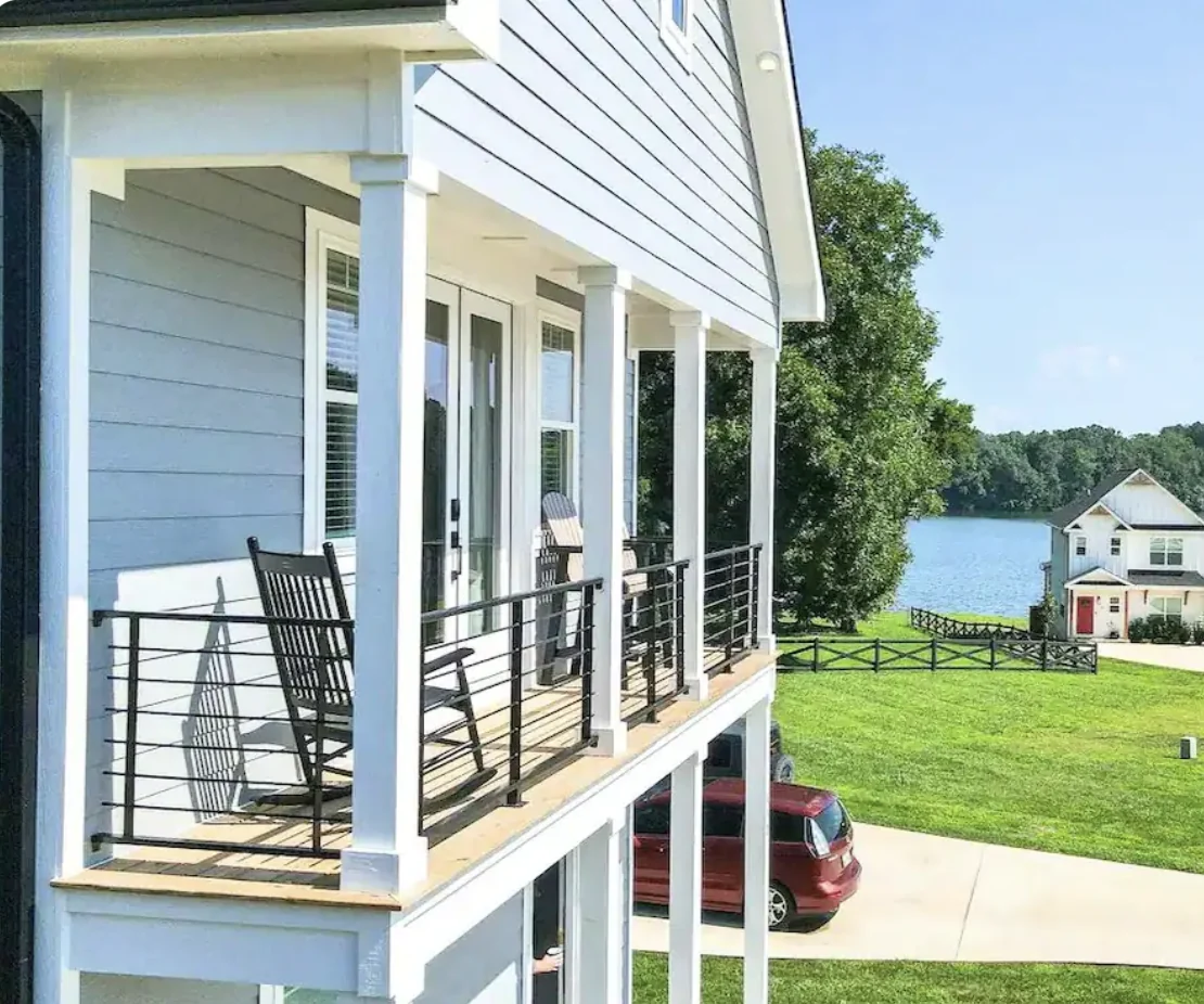 Porch seating overlooking a lake.