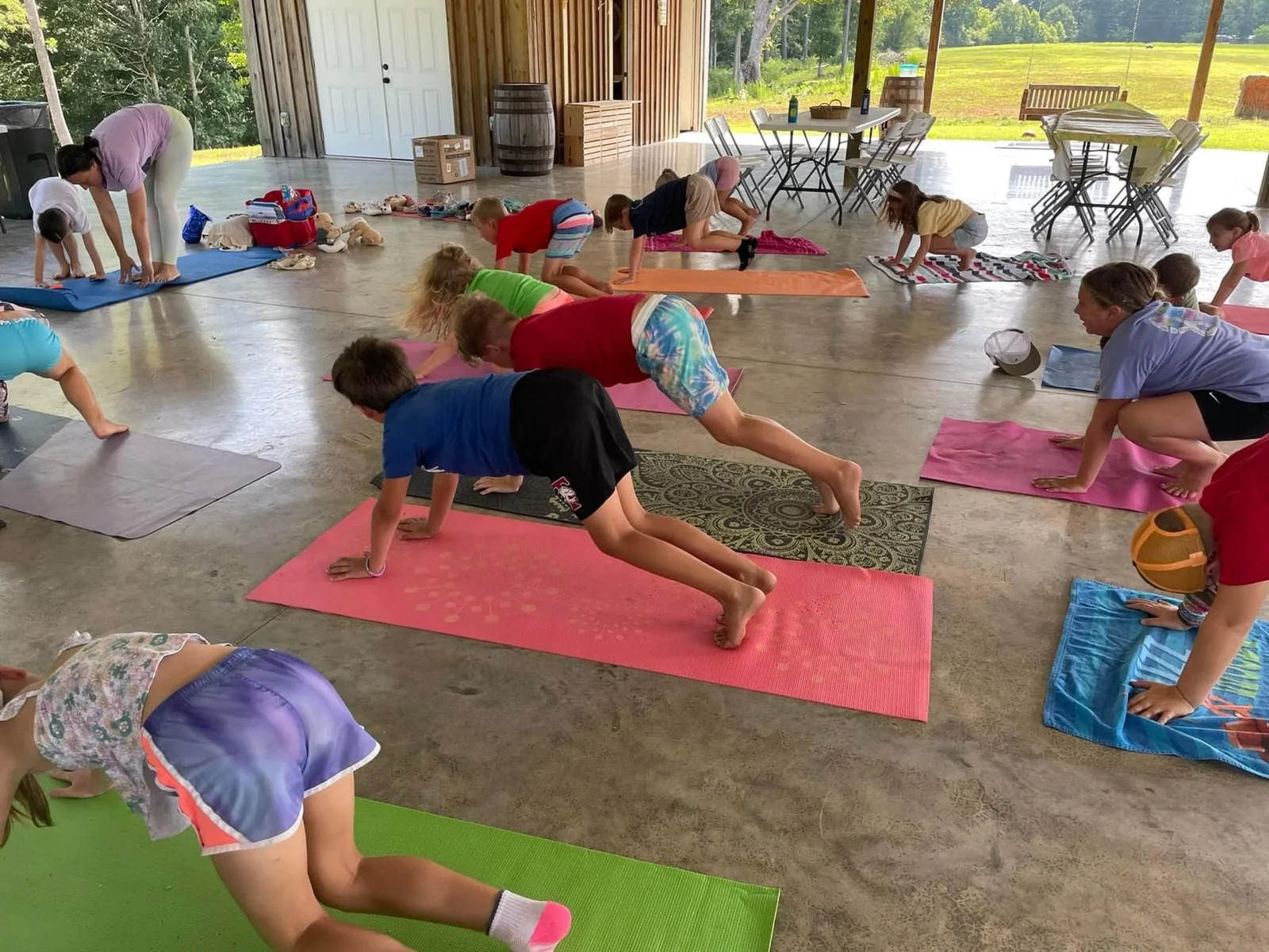 A group yoga session on mats.